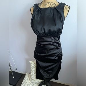 Nicole Miller black lined cocktail dress. Ruched bottom silky feel  size 10